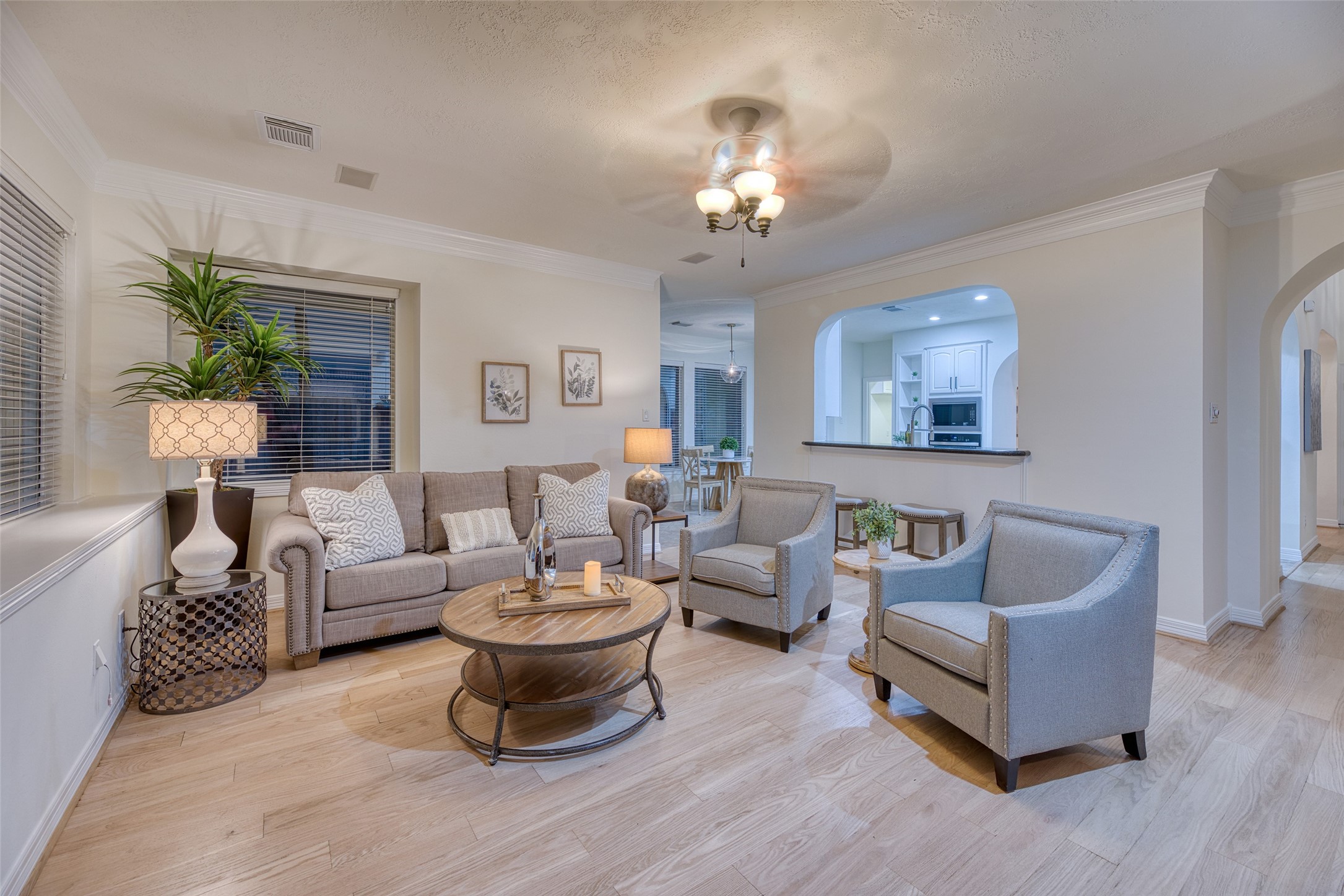 911 Chisel Point Drive Houston, TX 77094 - Photo 17 of 50 Spacious living area open to the kitchen and breakfast nook, complete with crown molding and neutral tones. Ideal for both relaxing and entertaining.