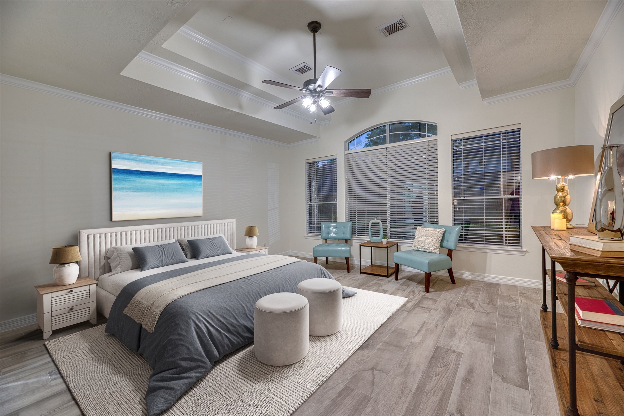 911 Chisel Point Drive Houston, TX 77094 - Photo 18 of 50 Virtually staged-Generously sized primary suite with tray ceiling, crown molding, and wood-look tile flooring. Large windows provide views of the pool.