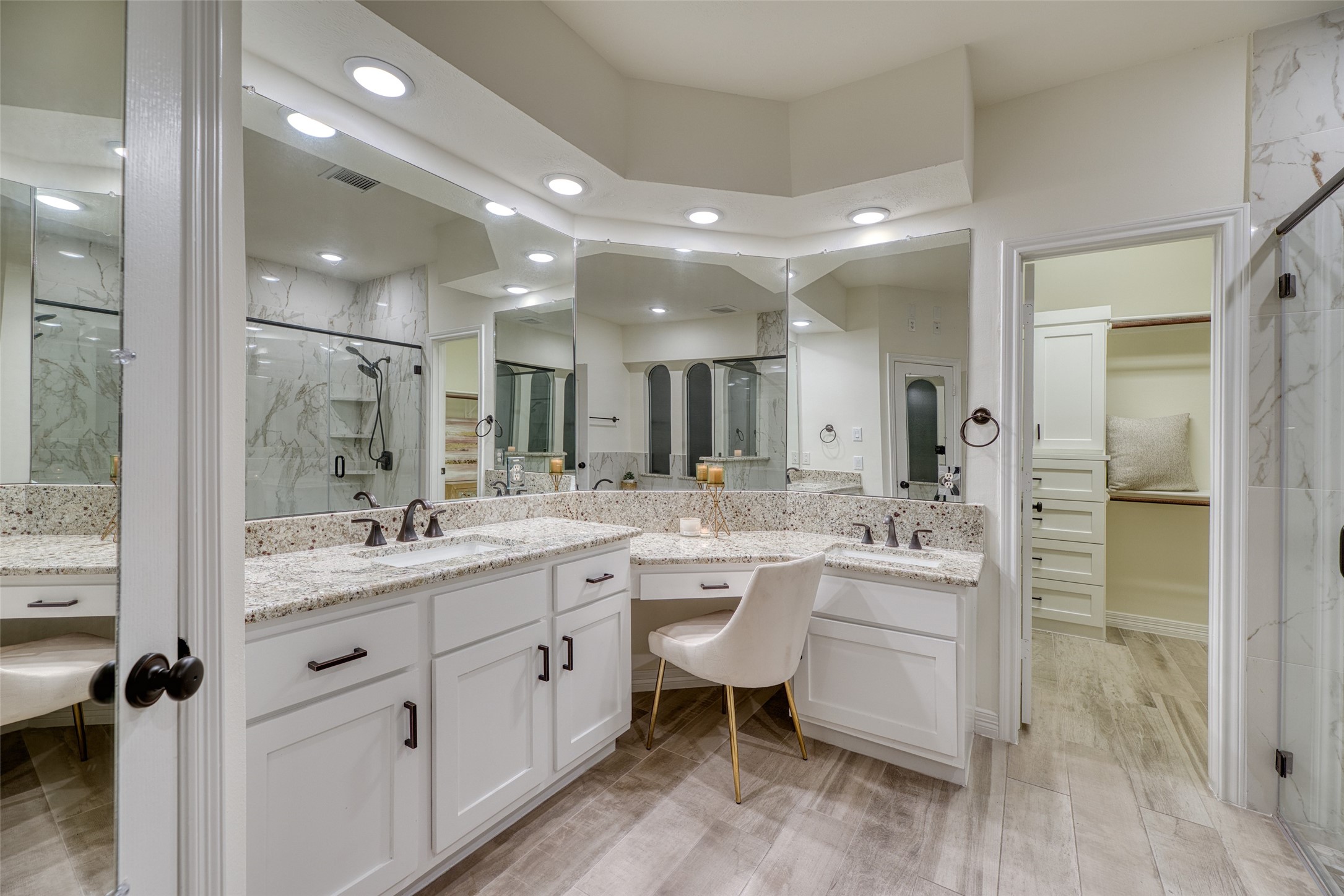 911 Chisel Point Drive Houston, TX 77094 - Photo 23 of 50 Bright and spacious bath with dual sinks, abundant cabinetry, and a seated vanity area. Perfect blend of functionality and elegance.