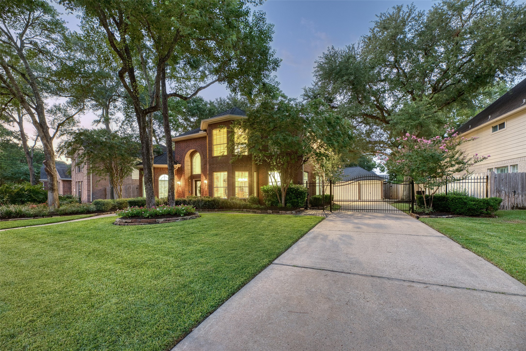911 Chisel Point Drive Houston, TX 77094 - Photo 3 of 50 This stately brick home welcomes you with a gated driveway, beautifully manicured lawn, and mature trees offering shade and charm. Thoughtfully landscaped flower beds frame the walkway, creating a stunning first impression.