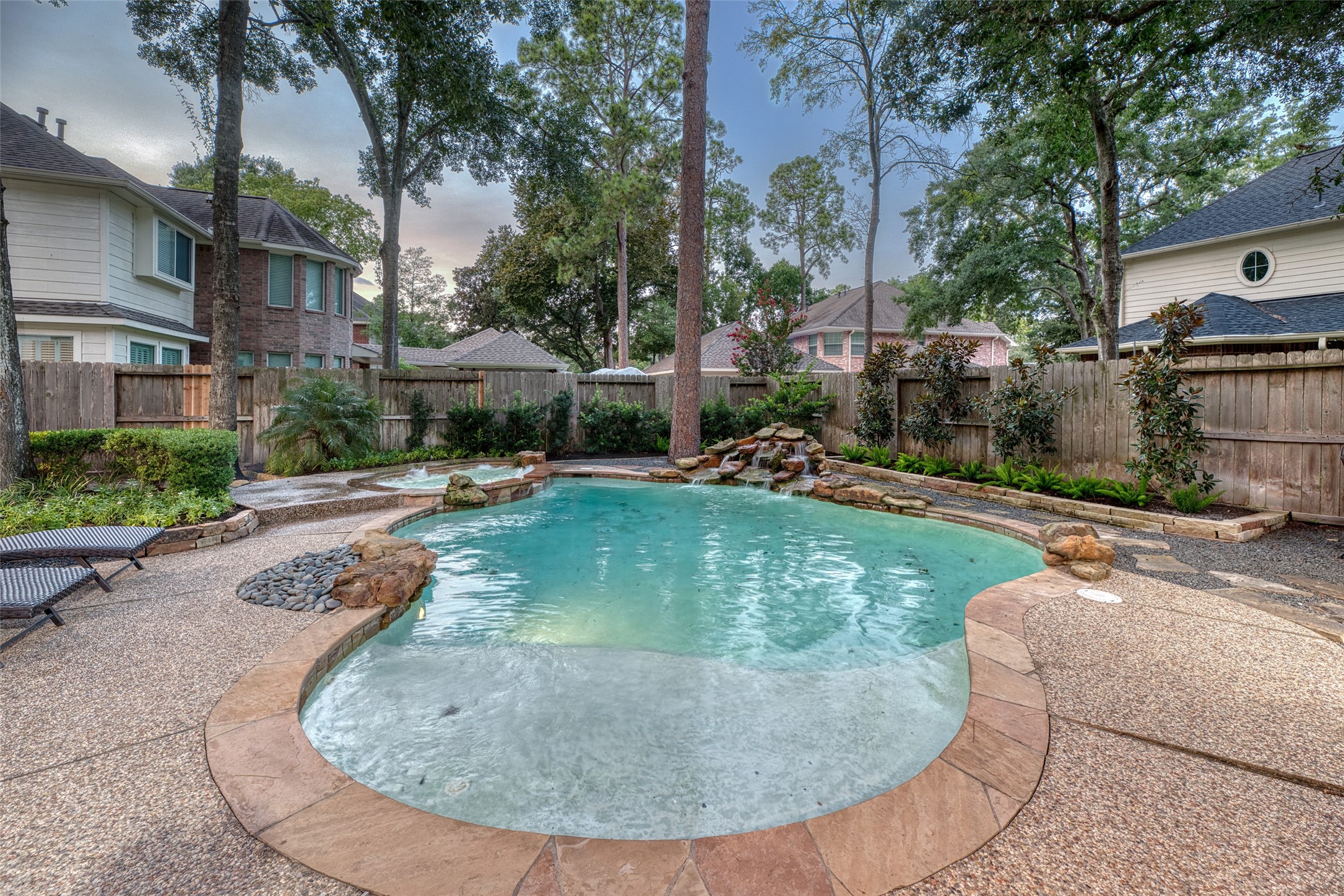 911 Chisel Point Drive Houston, TX 77094 - Photo 46 of 50 A refreshing pool with a shallow entry and stone-accented edging offers the perfect spot for relaxing summer days.