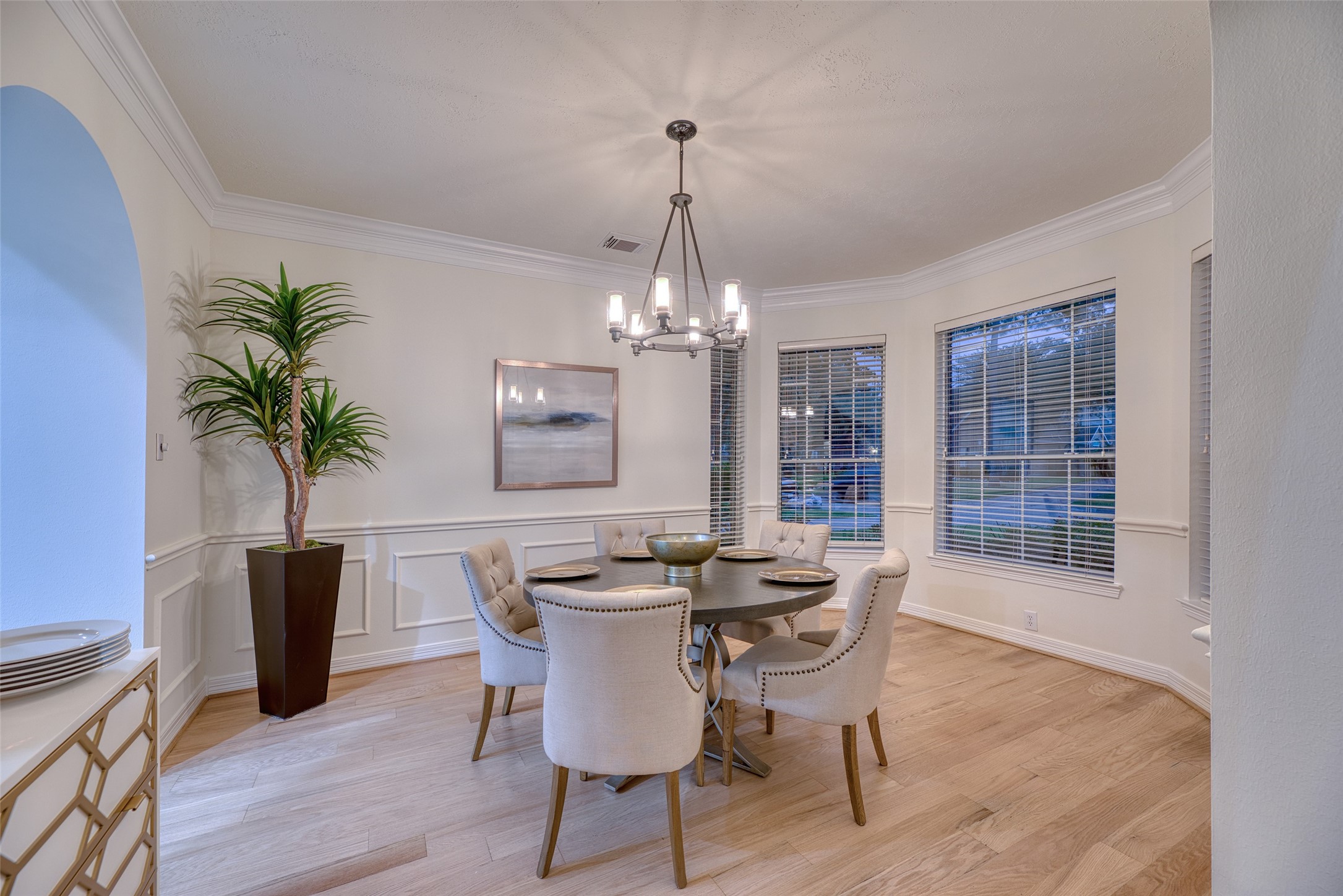 911 Chisel Point Drive Houston, TX 77094 - Photo 7 of 50 Charming formal dining room with bay windows, crown molding, and wainscoting. Perfect for hosting gatherings in style.