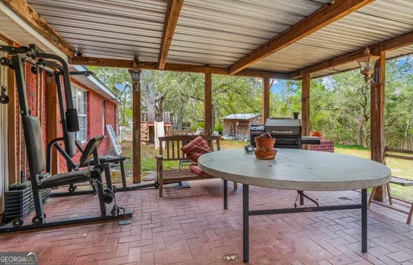 a view of a dining room with furniture window and outside view