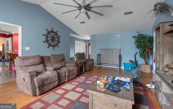 a living room with furniture and a rug