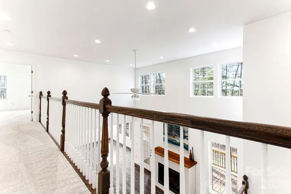 a view of a hallway with windows