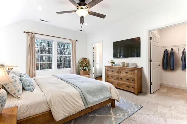a bathroom with a granite countertop toilet a sink and a bathtub