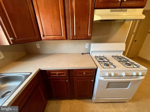 a kitchen with a stove and a microwave