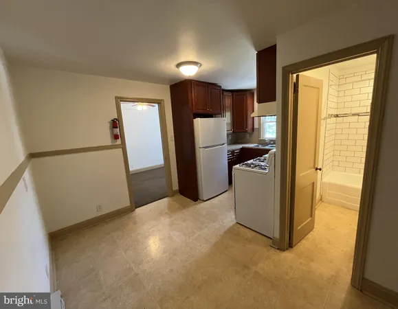 a view of a kitchen with a refrigerator a sink dishwasher and a refrigerator