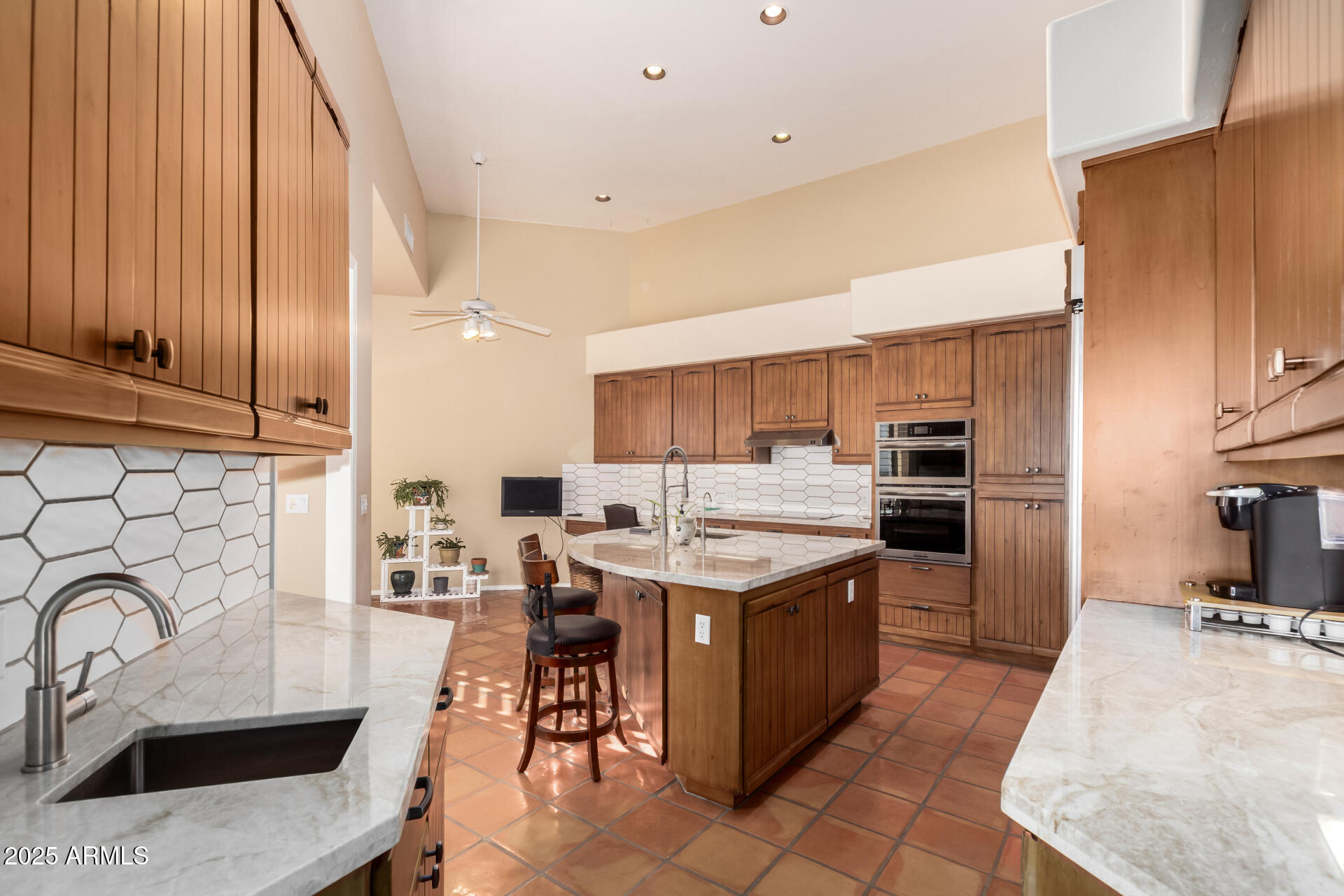 31 West Beryl Avenue Phoenix, AZ 85021 - Photo 12 of 65 a kitchen with a sink a counter top space stainless steel appliances and cabinets