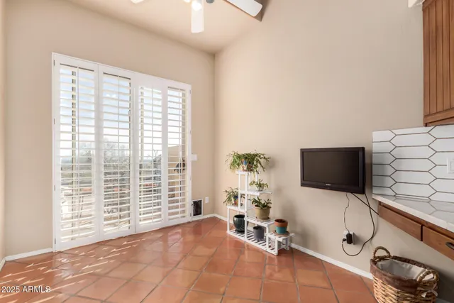 a view of a livingroom with furniture and a window