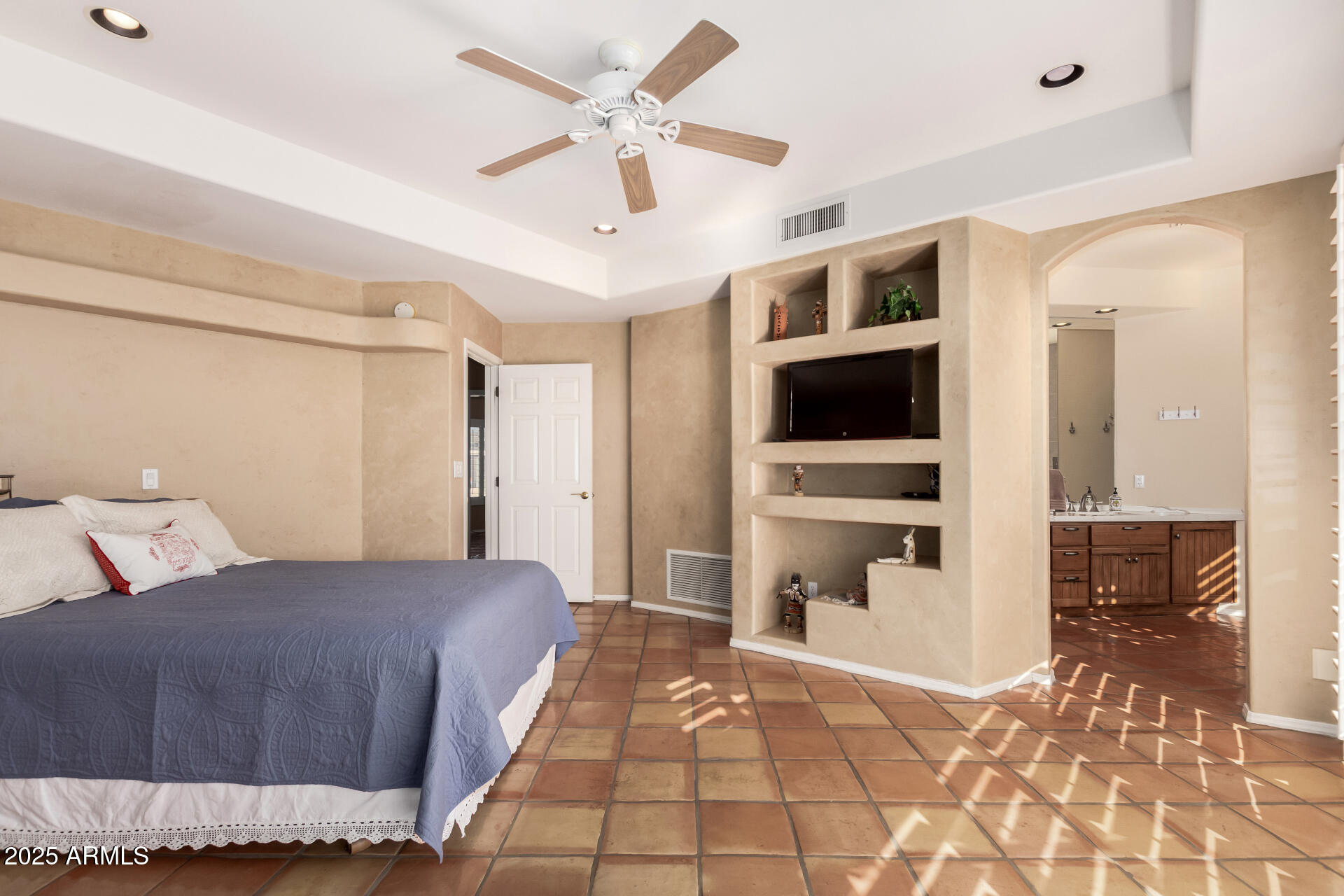 31 West Beryl Avenue Phoenix, AZ 85021 - Photo 22 of 65 a bedroom with a large bed a flat tv screen and a dresser