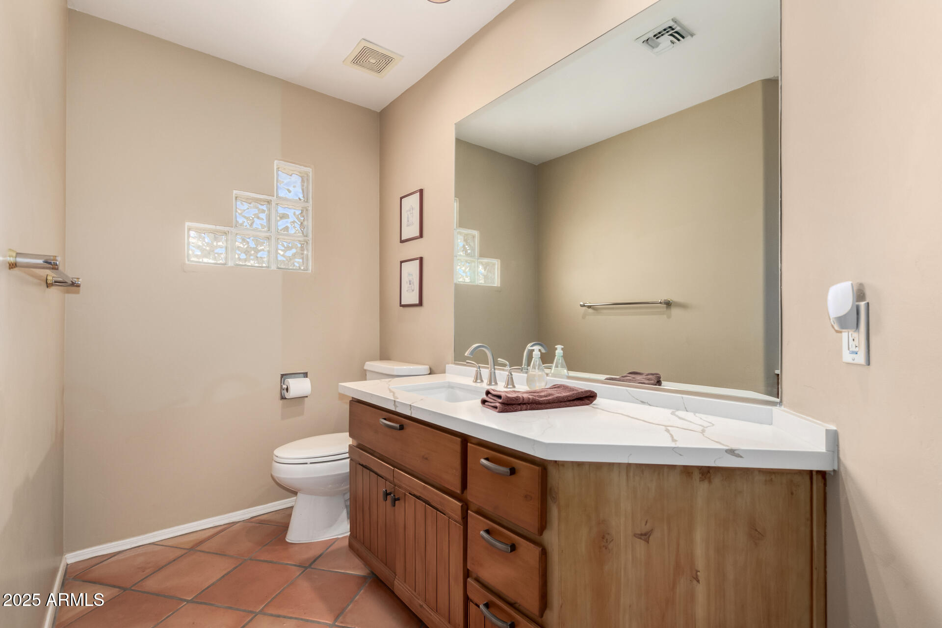 31 West Beryl Avenue Phoenix, AZ 85021 - Photo 30 of 65 a bathroom with a sink a toilet and mirror