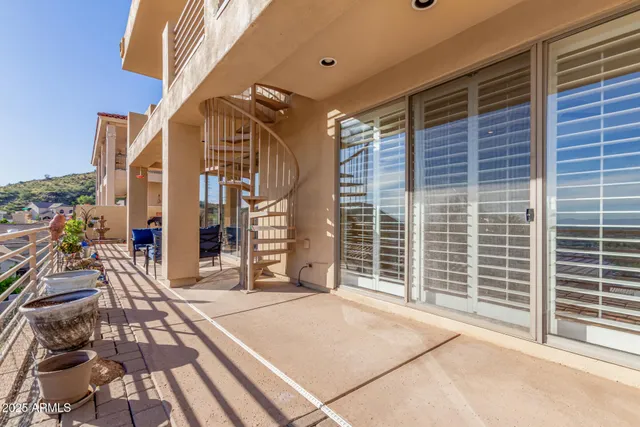 an aerial view of a house with a mountain