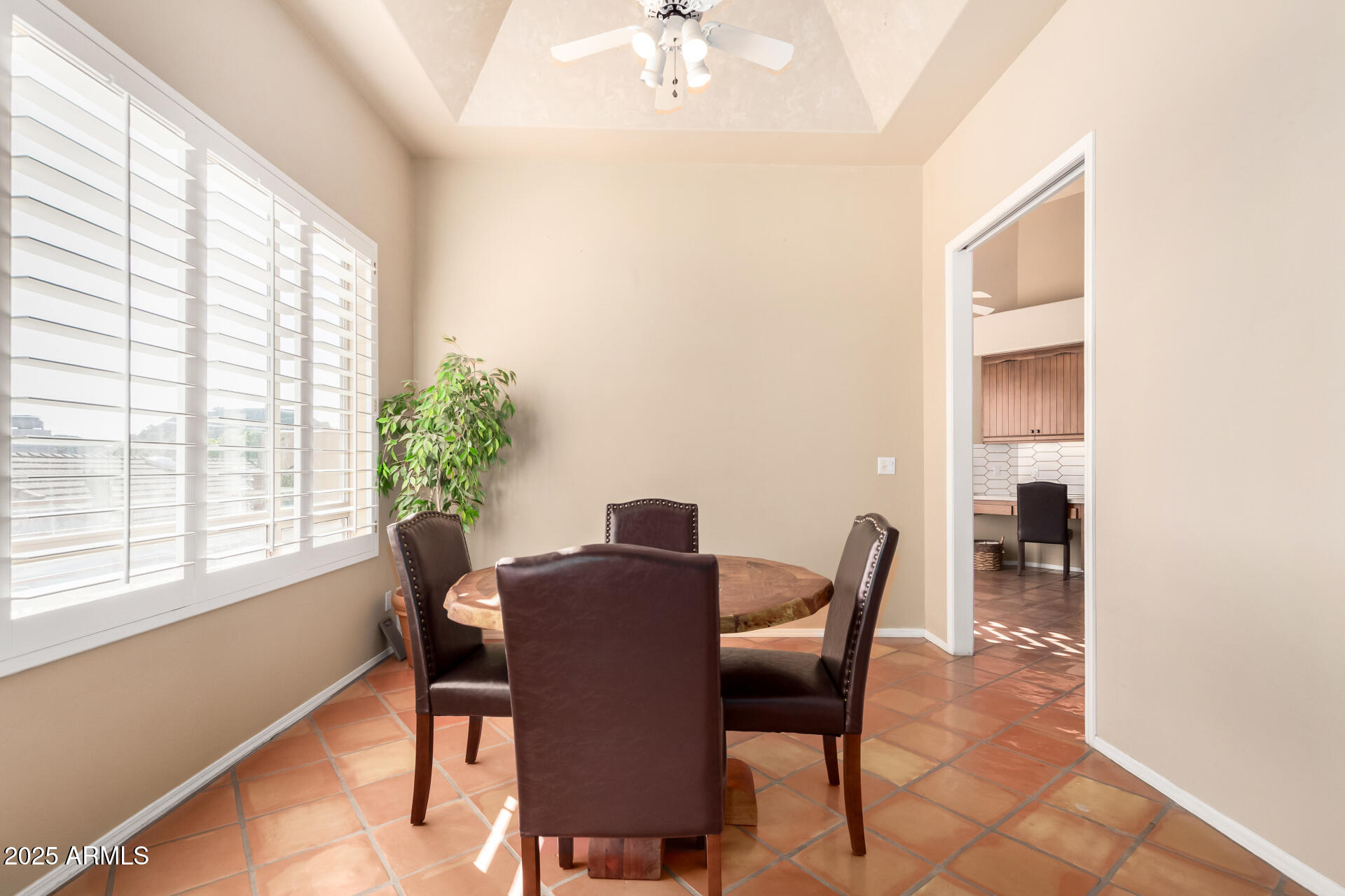 31 West Beryl Avenue Phoenix, AZ 85021 - Photo 9 of 65 a view of a dining room with furniture and a window