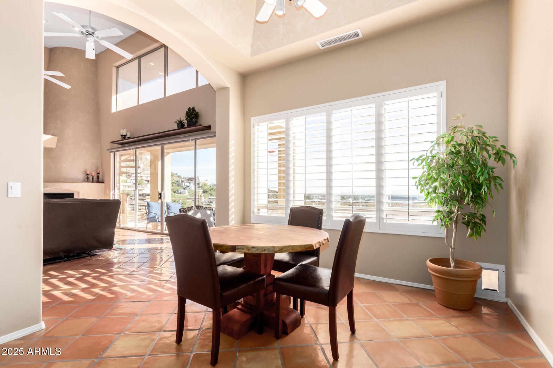 31 West Beryl Avenue Phoenix, AZ 85021 - Photo 10 of 65 a view of a dining room with furniture window and wooden floor