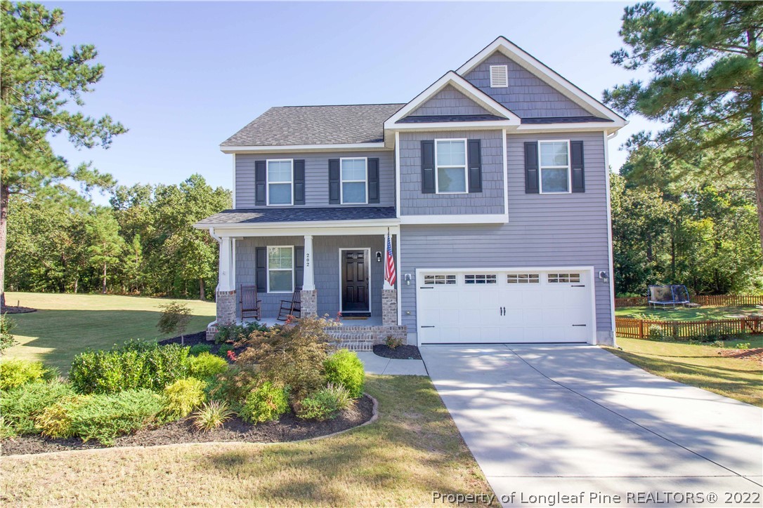 202 Sandy Springs Road Aberdeen, NC 28315 - Photo 1 of 44 a front view of a house with a yard