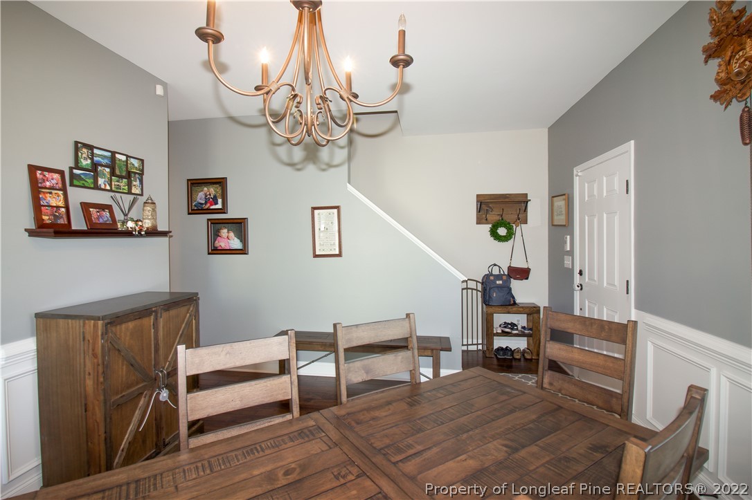 202 Sandy Springs Road Aberdeen, NC 28315 - Photo 13 of 44 a view of livingroom with furniture and chandelier