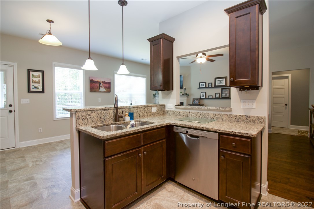 202 Sandy Springs Road Aberdeen, NC 28315 - Photo 18 of 44 a kitchen with a sink and a refrigerator