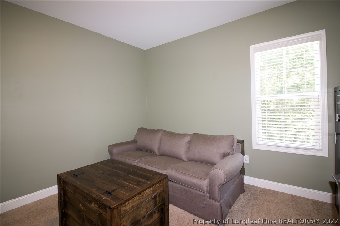 202 Sandy Springs Road Aberdeen, NC 28315 - Photo 35 of 44 a living room with furniture and a window