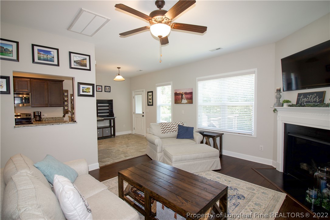 202 Sandy Springs Road Aberdeen, NC 28315 - Photo 6 of 44 a living room with furniture and a flat screen tv