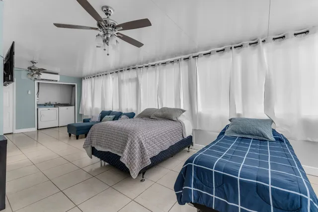 a bedroom with double bed and a window