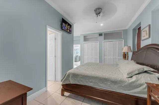 a bedroom with a bed and a lamp