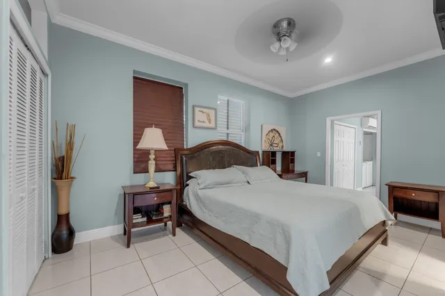 a bedroom with a bed and a table