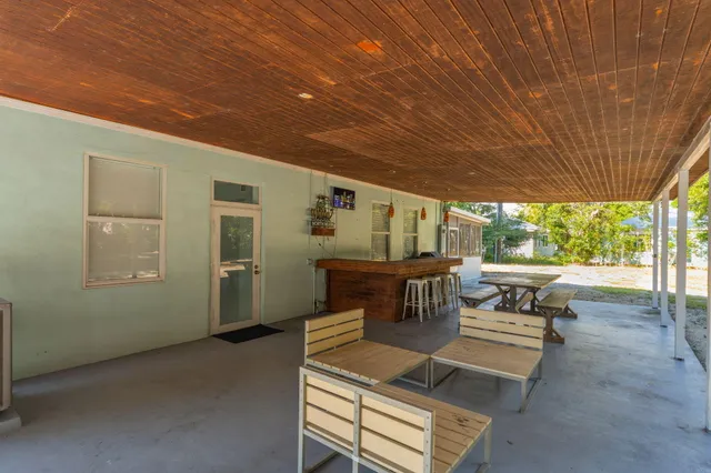 a patio with patio a couch and chairs