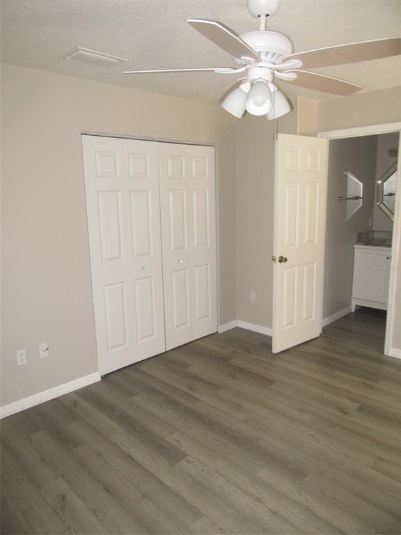 1090 Nomad Road Punta Gorda, FL 33983 - Photo 12 of 16 a view of an empty room with wooden floor