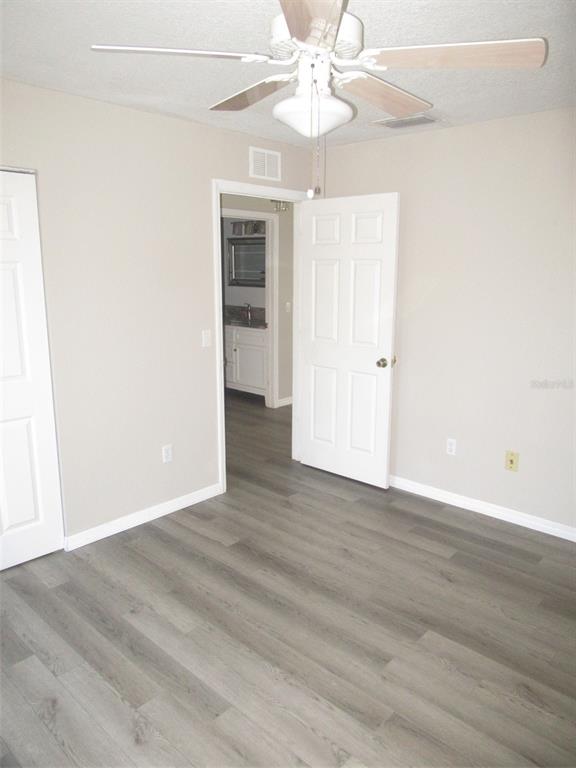 1090 Nomad Road Punta Gorda, FL 33983 - Photo 10 of 16 wooden floor in an empty room