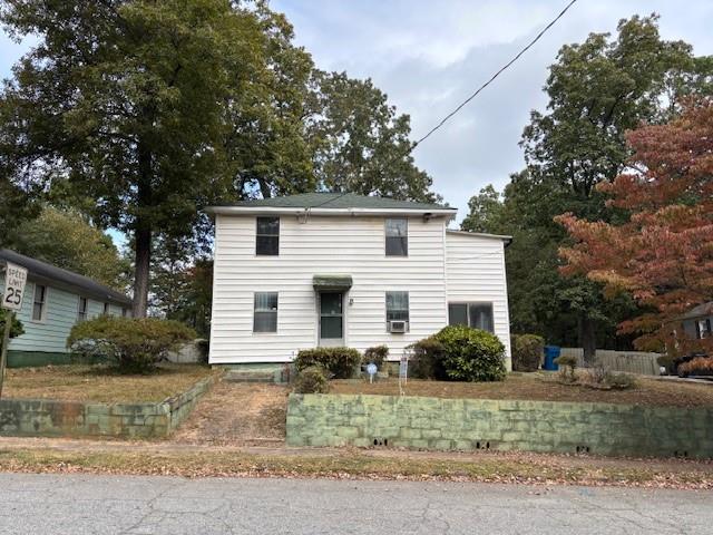 1303 Womack Avenue East Point, GA 30344 - Photo 1 of 1 a front view of a house with garden