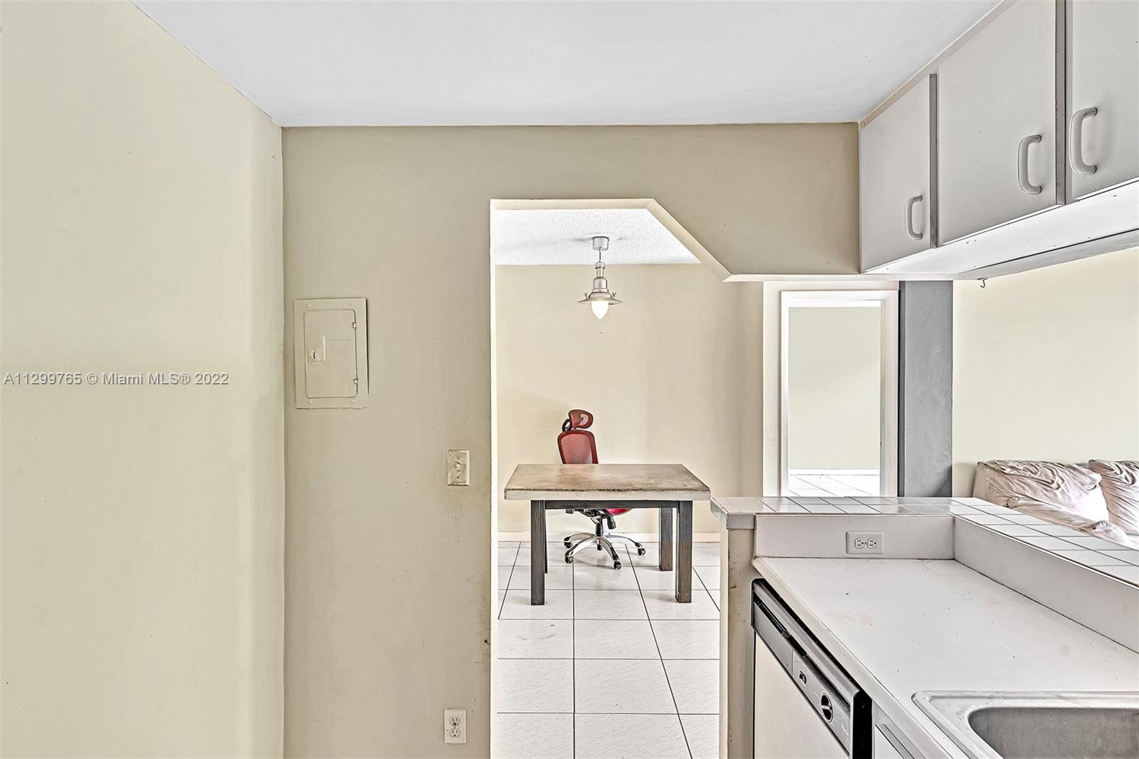 2201 Brickell Avenue, Unit 89 Miami, FL 33129 - Photo 12 of 56 a living room with furniture and a window