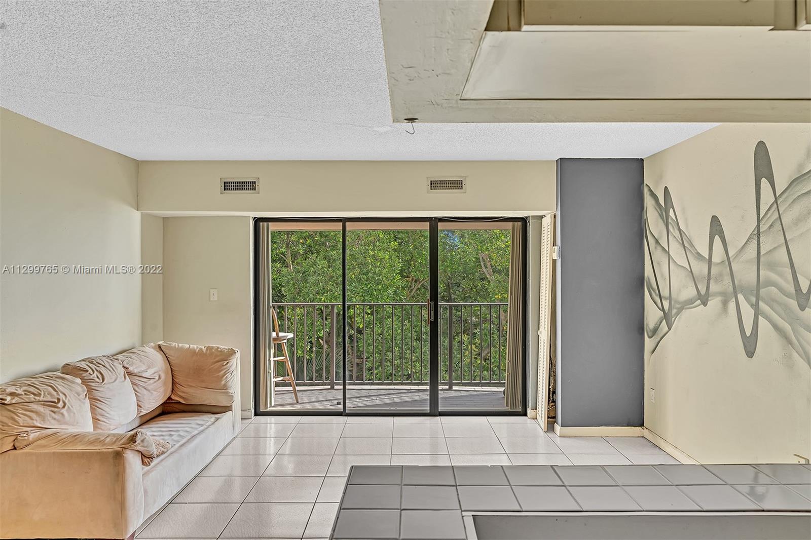 2201 Brickell Avenue, Unit 89 Miami, FL 33129 - Photo 14 of 56 a living room with furniture and a rug