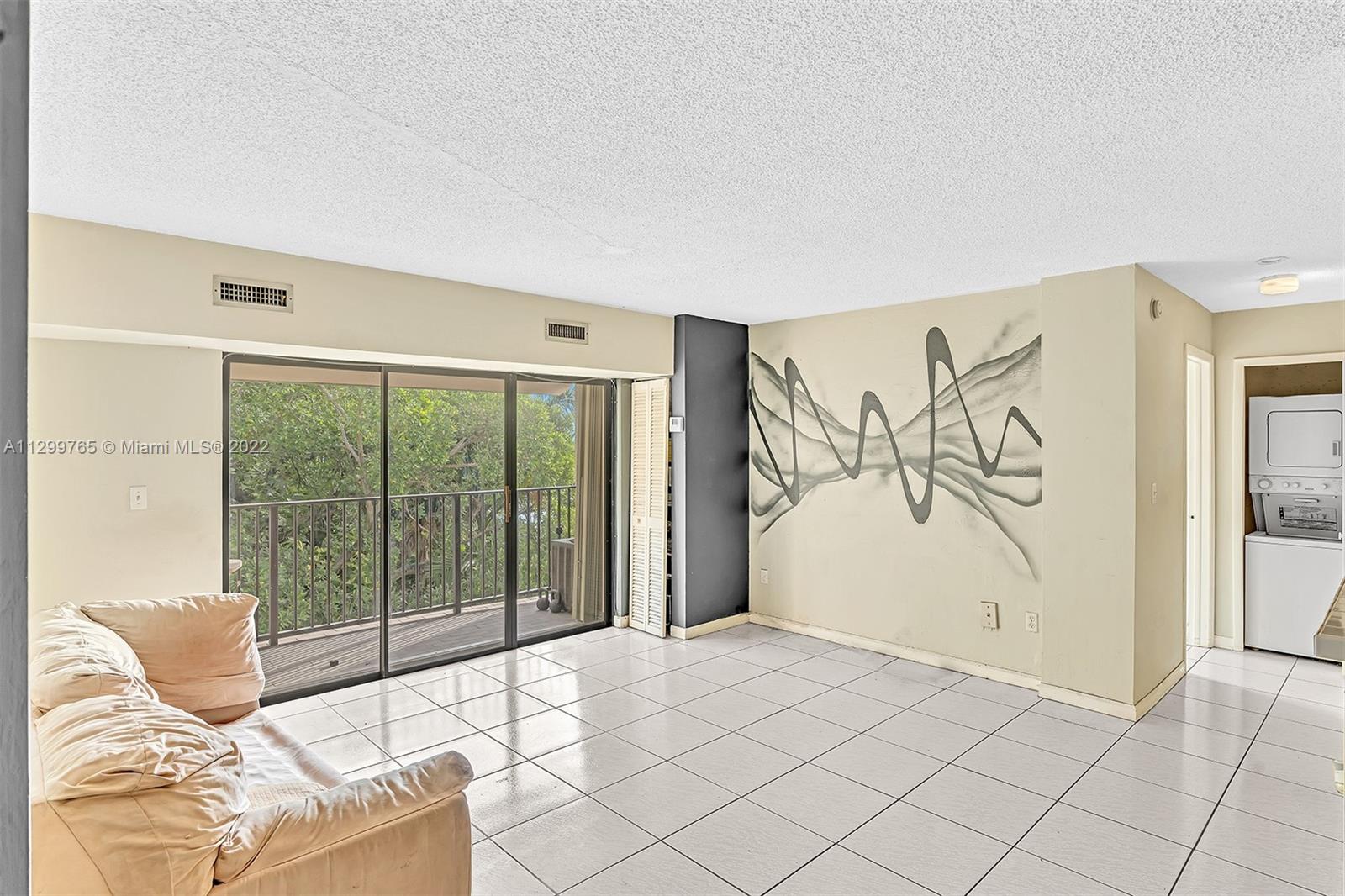 2201 Brickell Avenue, Unit 89 Miami, FL 33129 - Photo 16 of 56 a living room with a large window