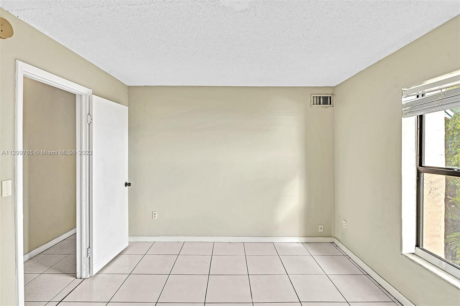 2201 Brickell Avenue, Unit 89 Miami, FL 33129 - Photo 26 of 56 a view of an empty room and window