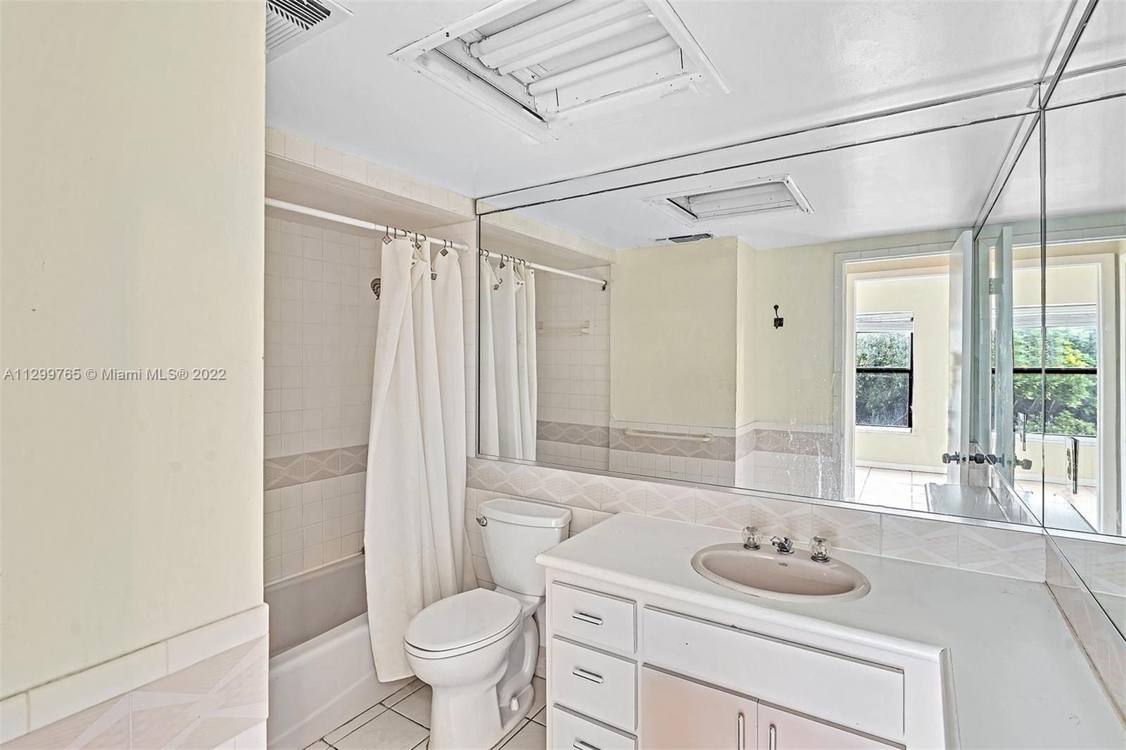 2201 Brickell Avenue, Unit 89 Miami, FL 33129 - Photo 27 of 56 a bathroom with a sink toilet and shower