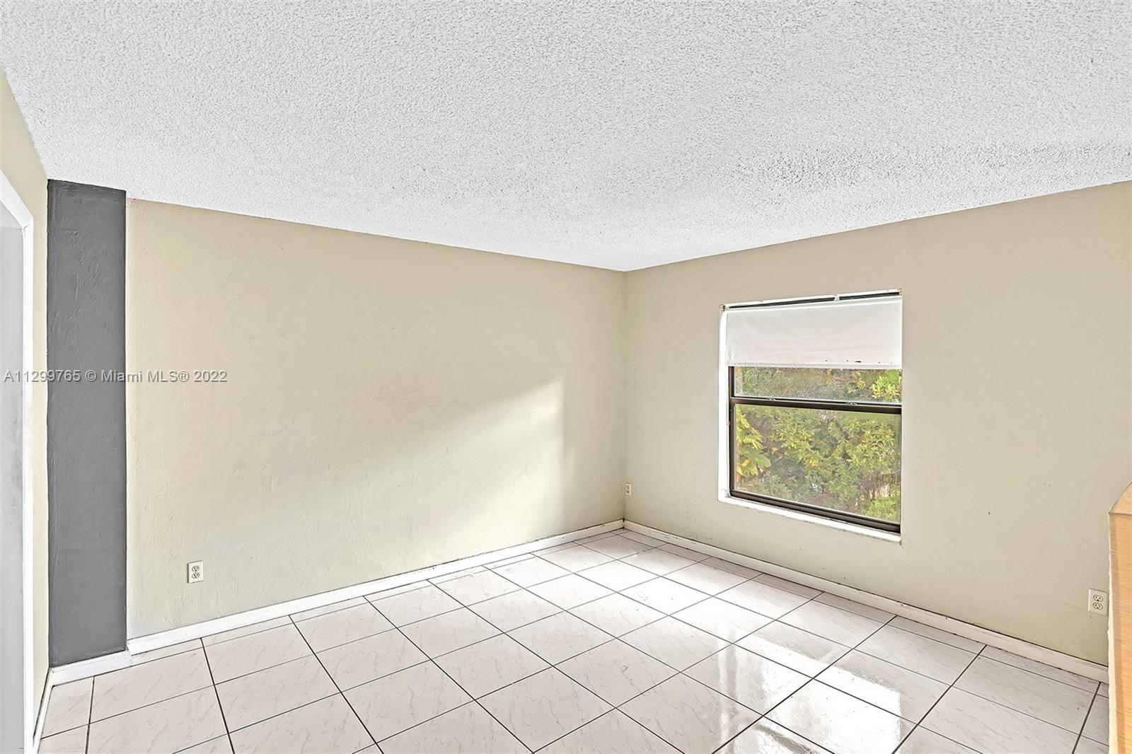 2201 Brickell Avenue, Unit 89 Miami, FL 33129 - Photo 28 of 56 an empty room with windows