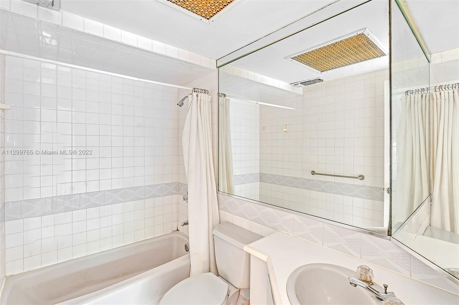 2201 Brickell Avenue, Unit 89 Miami, FL 33129 - Photo 32 of 56 a bathroom with a shower and a toilet