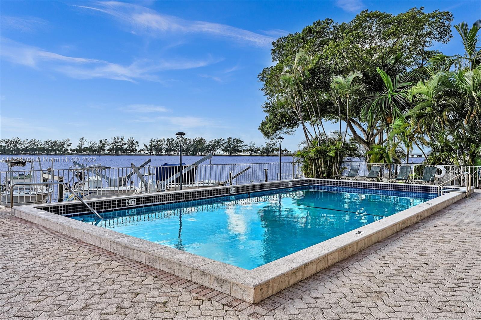 2201 Brickell Avenue, Unit 89 Miami, FL 33129 - Photo 36 of 56 a view of a swimming pool with a lounge chairs