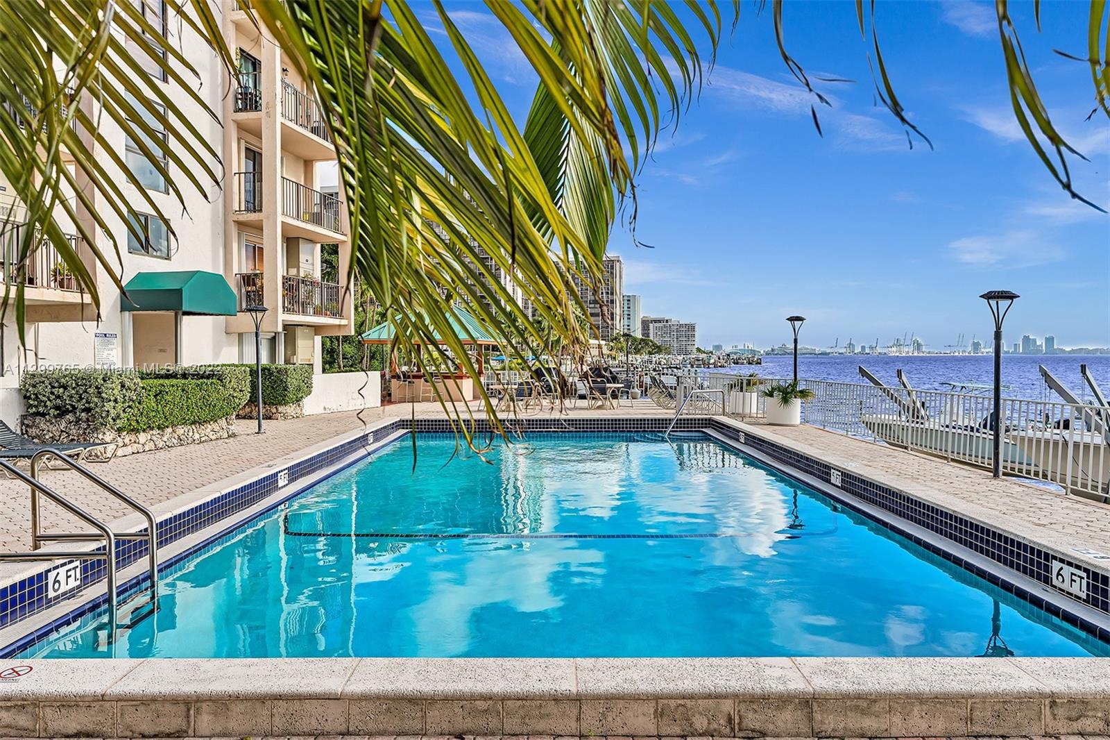 2201 Brickell Avenue, Unit 89 Miami, FL 33129 - Photo 40 of 56 a swimming pool with outdoor seating and deck