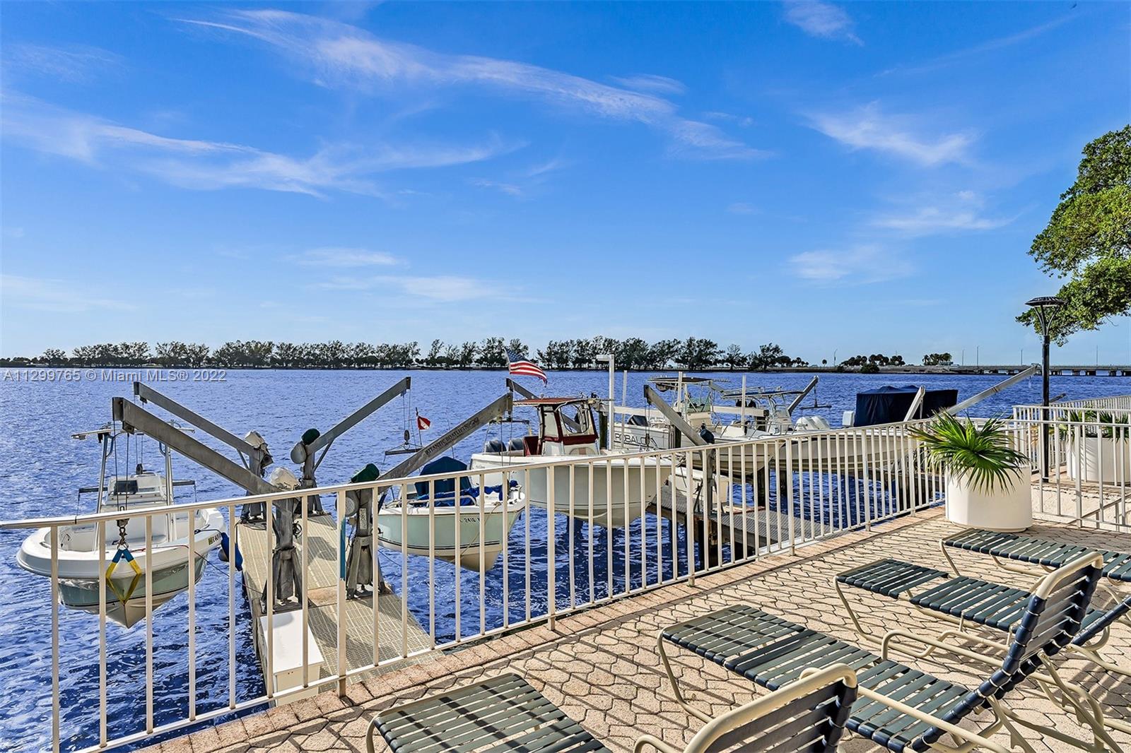 2201 Brickell Avenue, Unit 89 Miami, FL 33129 - Photo 41 of 56 a view of a balcony with wooden floor and city view
