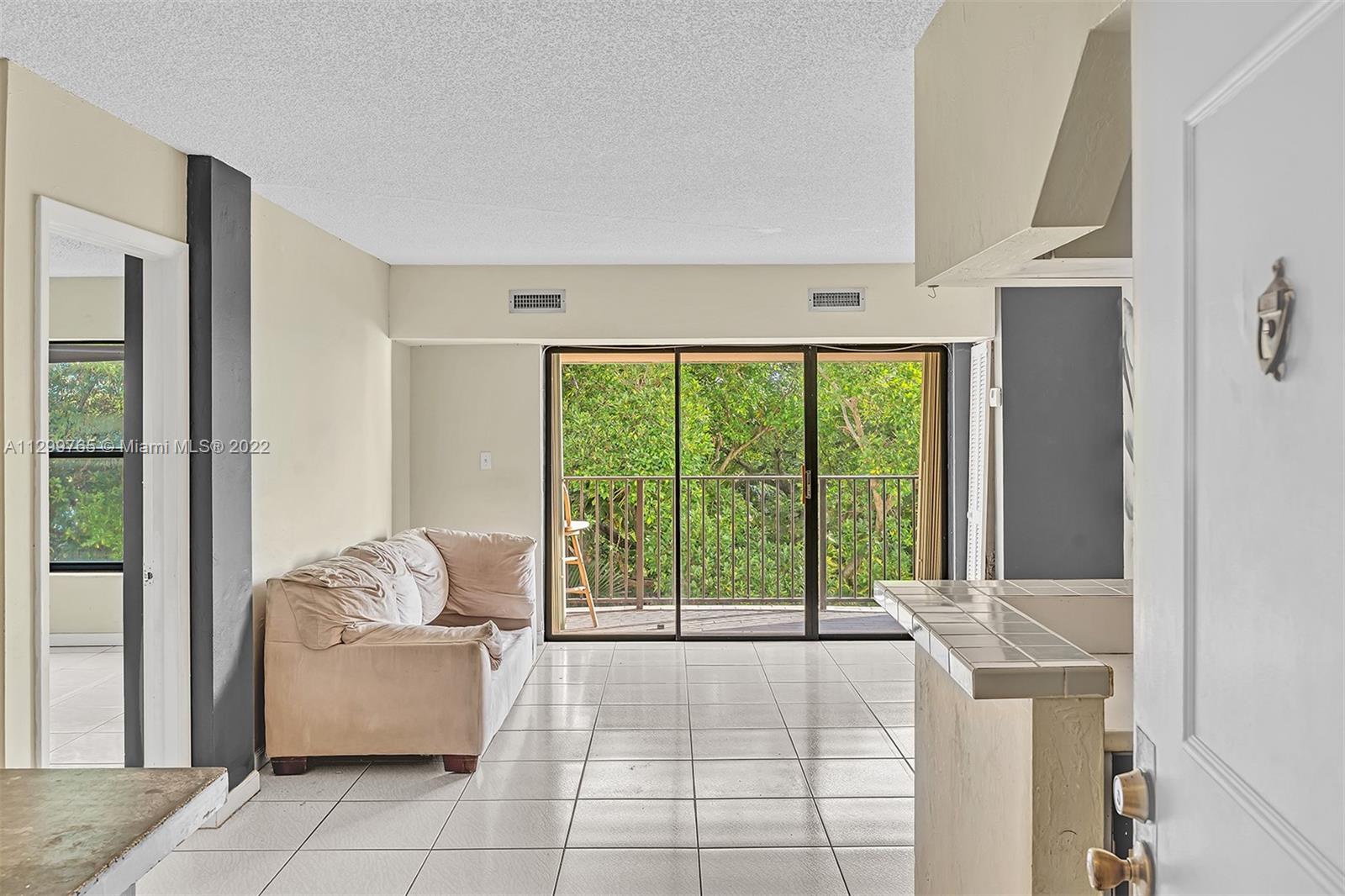 2201 Brickell Avenue, Unit 89 Miami, FL 33129 - Photo 5 of 56 a living room with furniture and a window