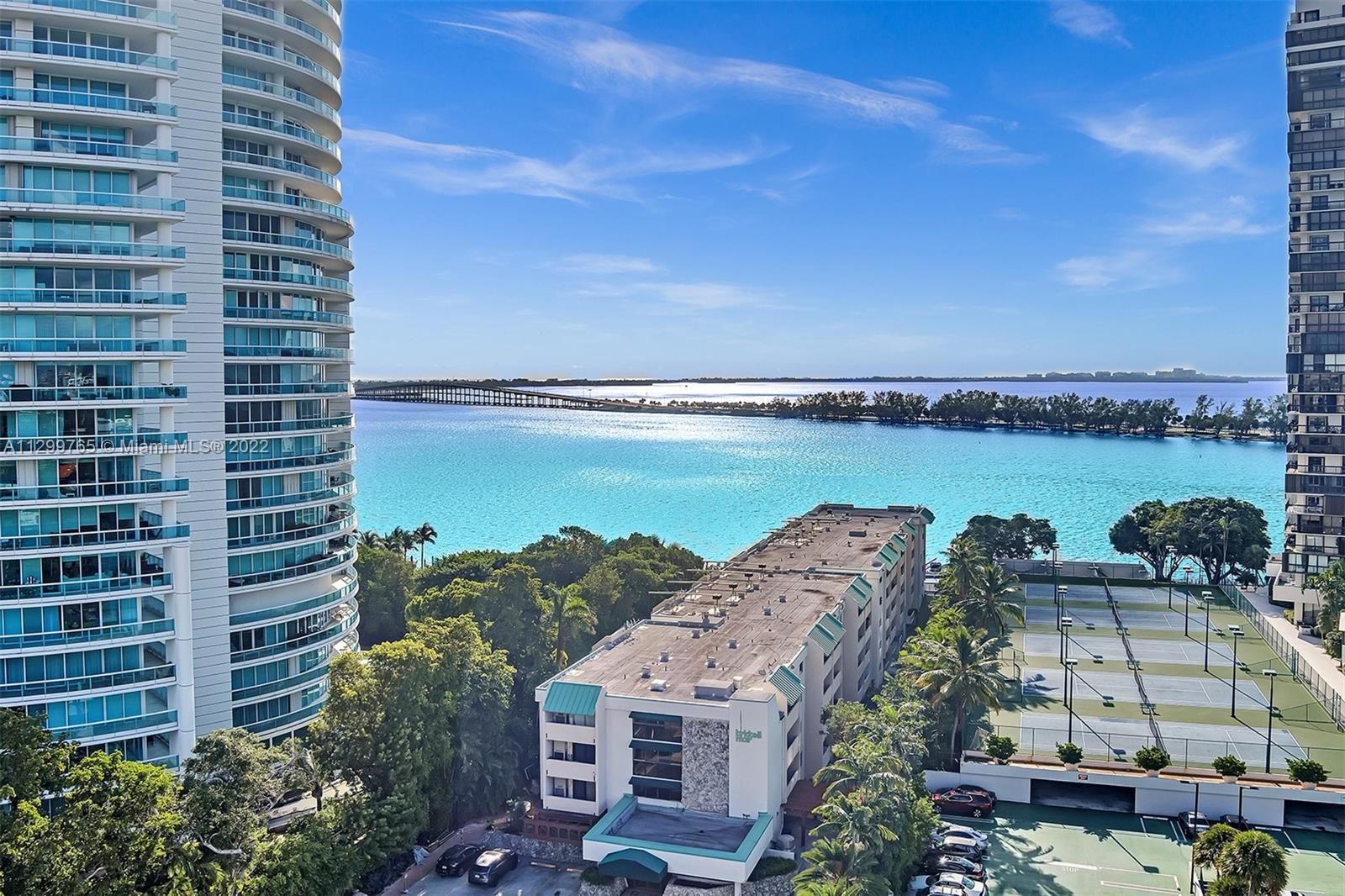 2201 Brickell Avenue, Unit 89 Miami, FL 33129 - Photo 54 of 56 a view of a lake with building in front of it