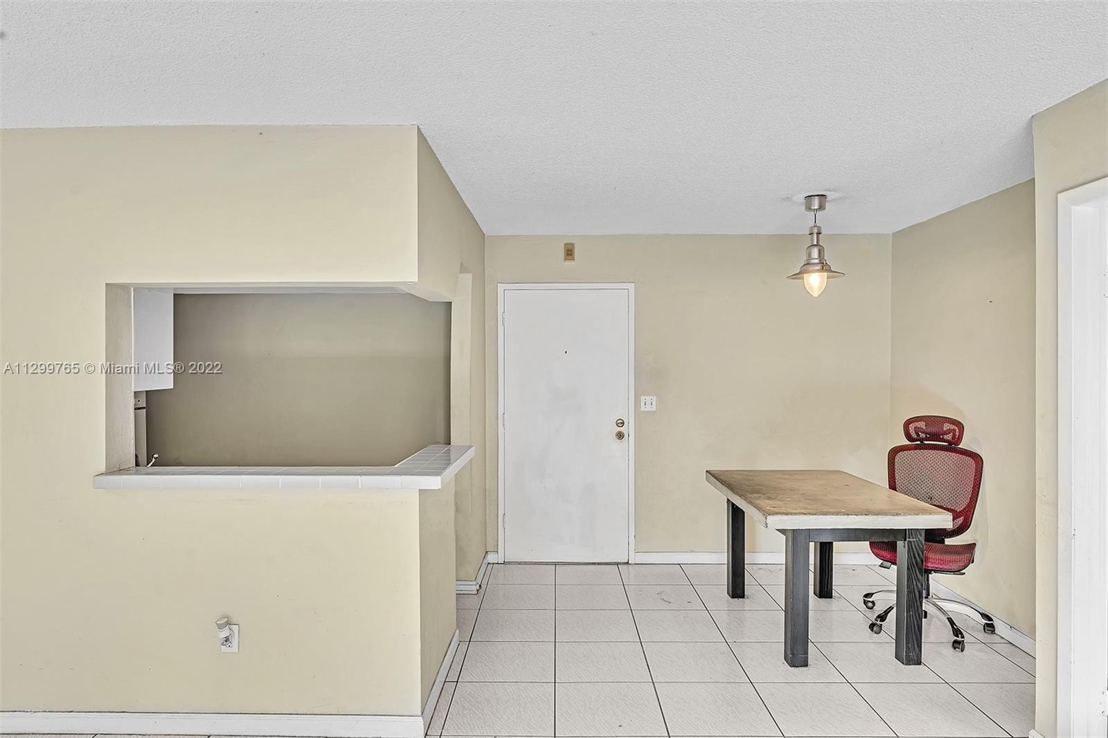 2201 Brickell Avenue, Unit 89 Miami, FL 33129 - Photo 10 of 56 a view of a hallway to a room and livingroom with furniture