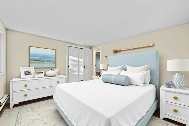 a bedroom with a bed and a night stand