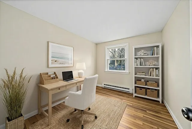 a workspace with furniture and window