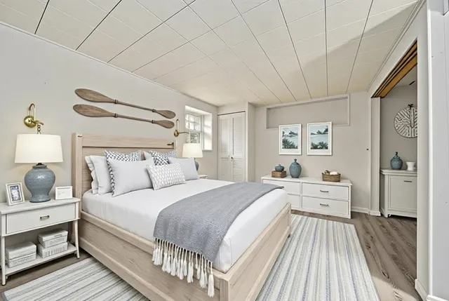 a spacious bedroom with a bed and a large window