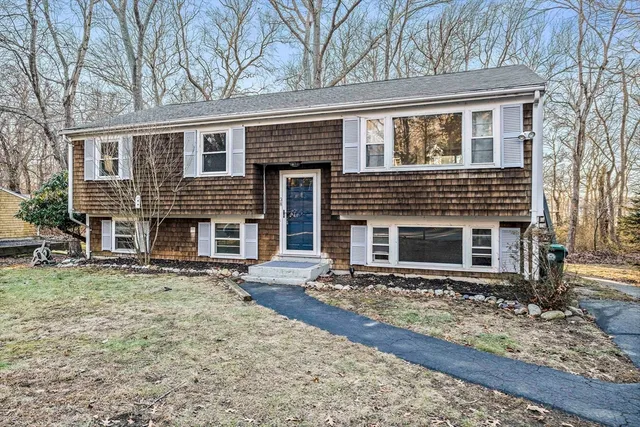 a front view of a house with yard