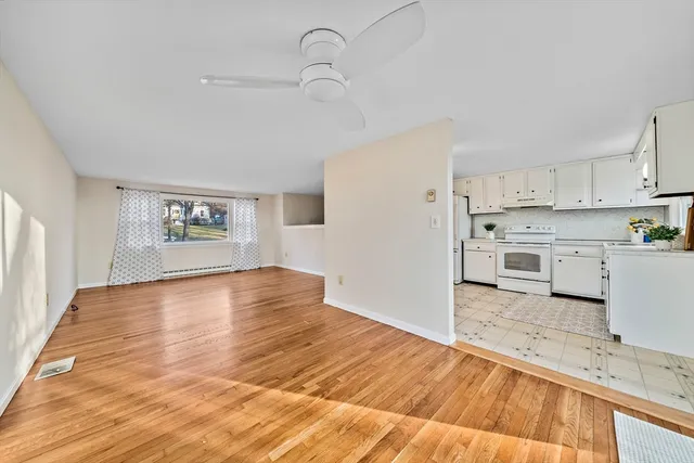 a view of a kitchen with wooden floor