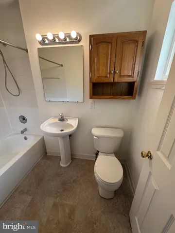 a bathroom with a sink and a shower